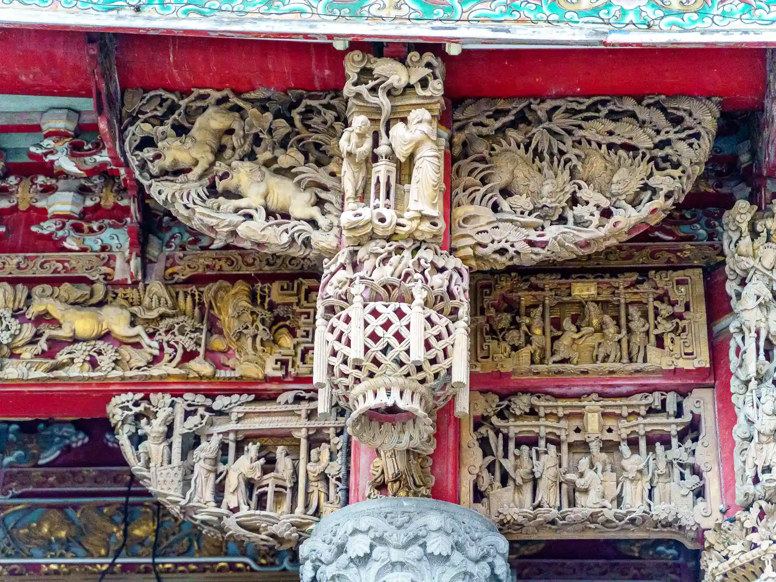 Mythical beasts and gods are carved into the borders of the roof.