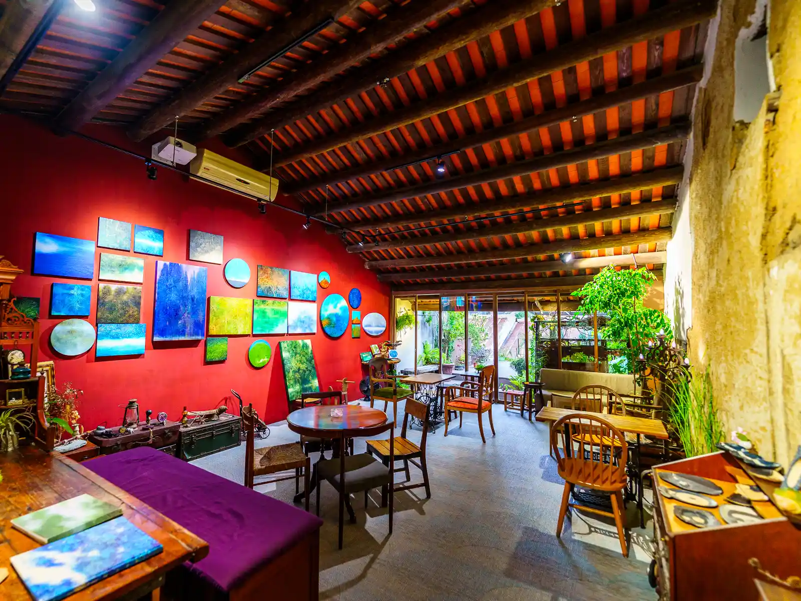 Antique furniture is mixed together to form the seating area of the second floor cafe in Su Chiung Art Museum.