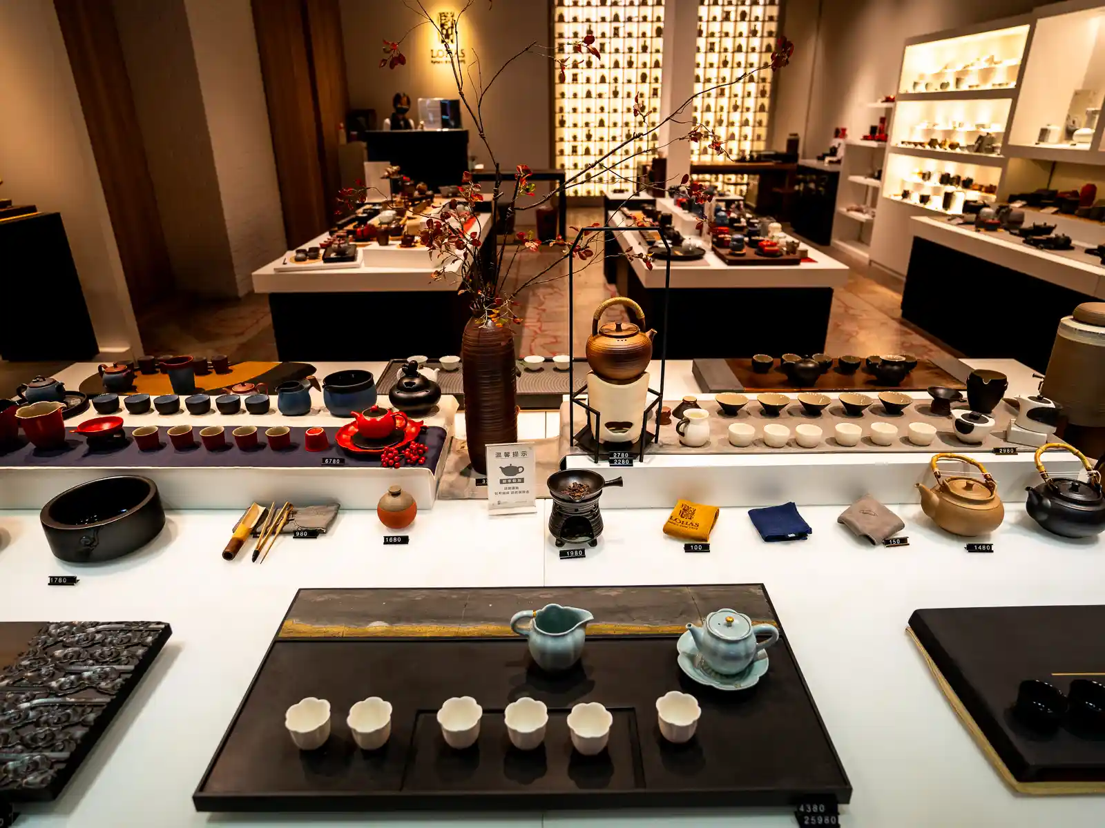Multiple tables display exquisite modern teaware in a boutique in Yingge.