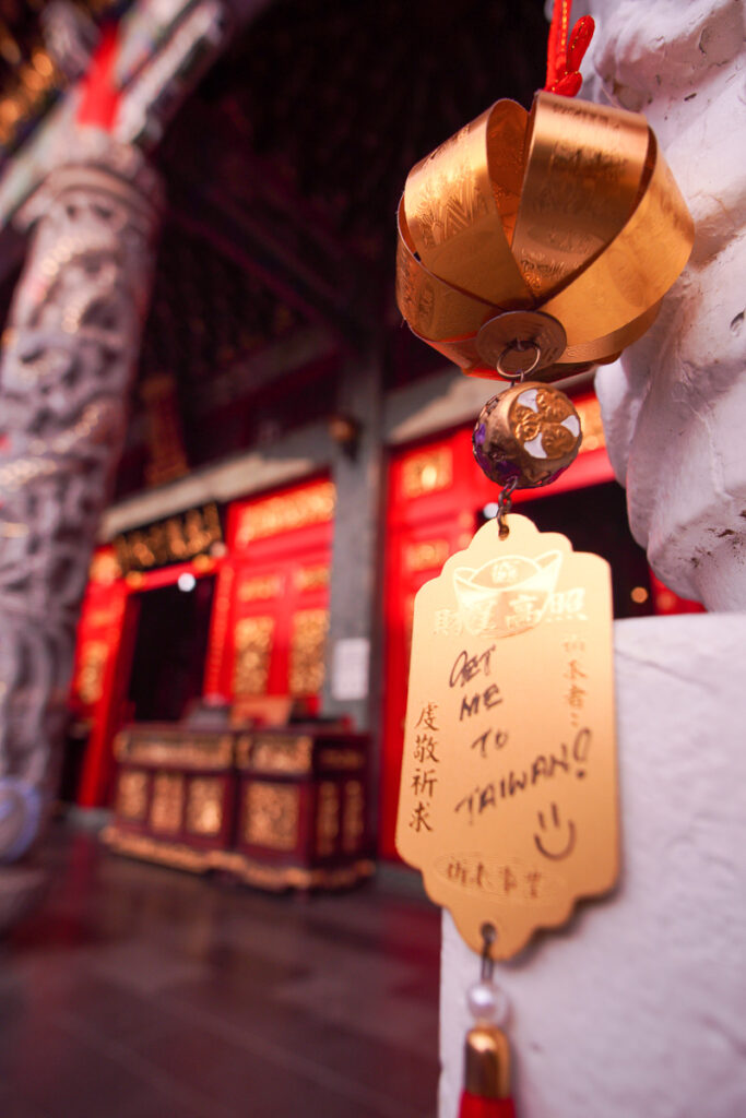 A wish talisman hanging on the wall of the temple.