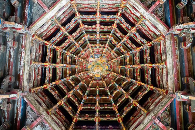 Looking into the geometrical patterns of the the pavilion's spider web (caisson) ceiling.