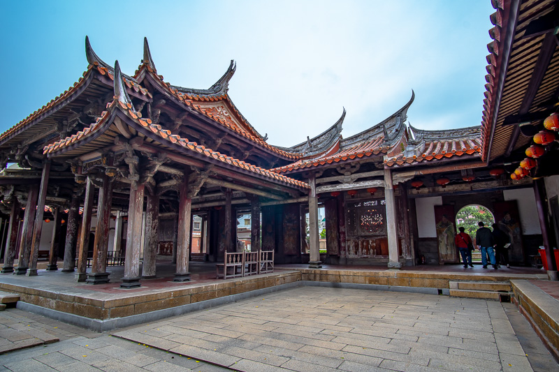 This classic temple features stone sculptures, woodcarving, hand-painting, and ridge cresting.