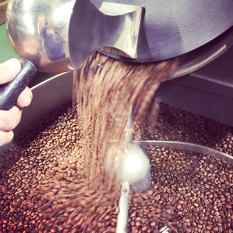 Roasting coffee beans.