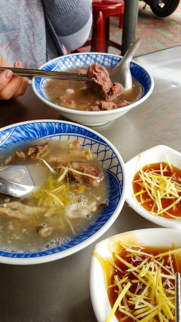 Beef soup served on the street with ginger and thick soy sauce.
