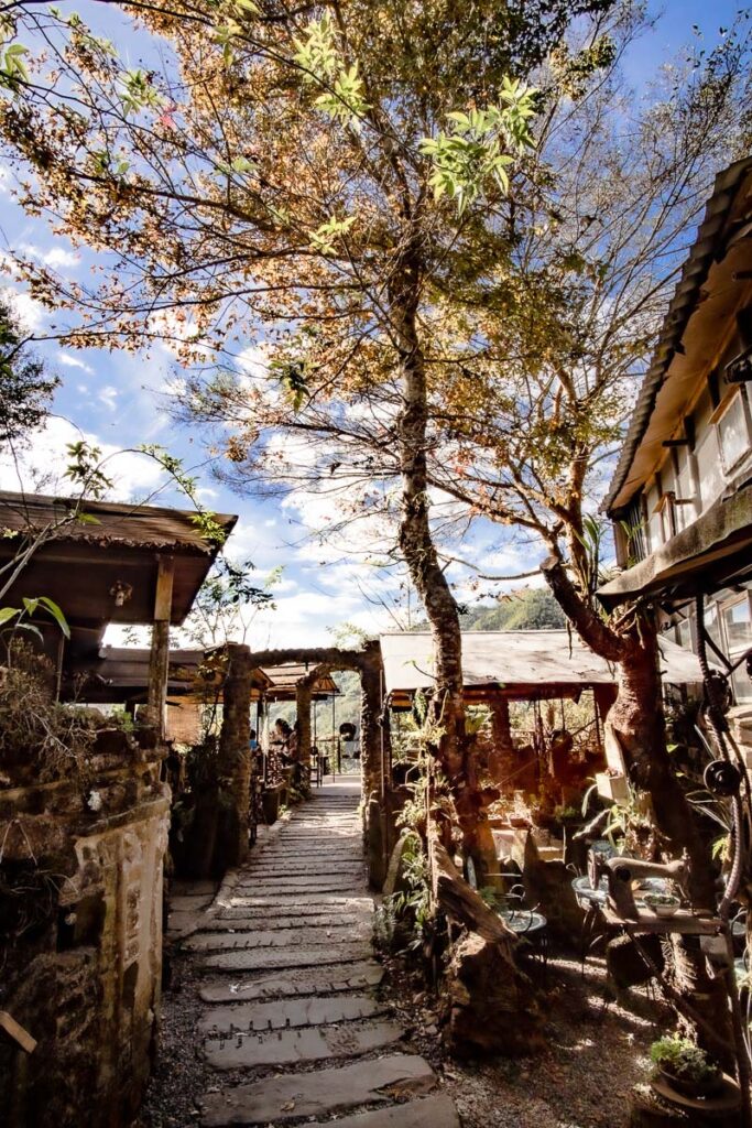 A walkway leads through Ajang Home 23 Coffe House.