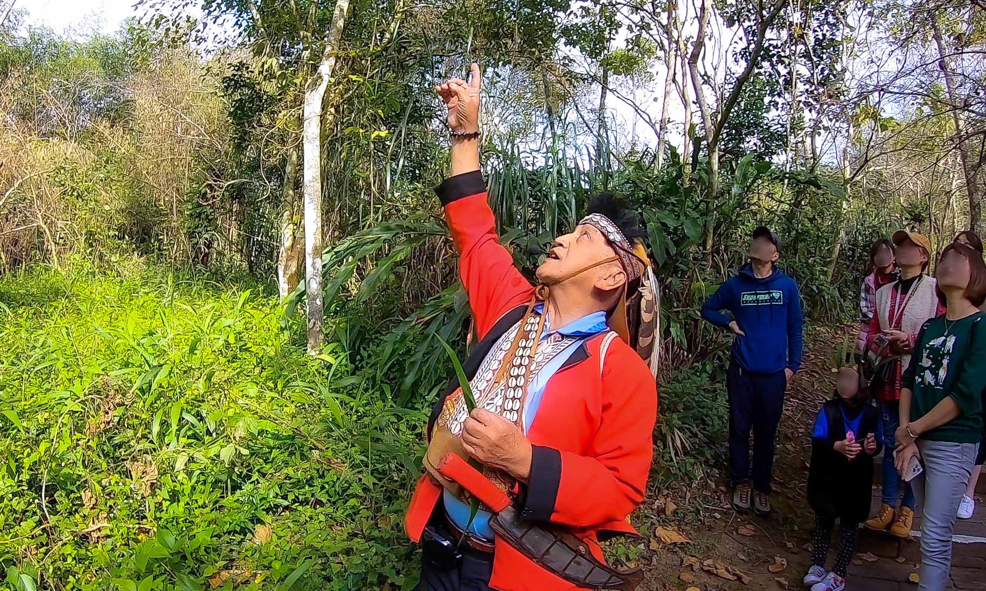 A Tsou elder leads an eco-tour.