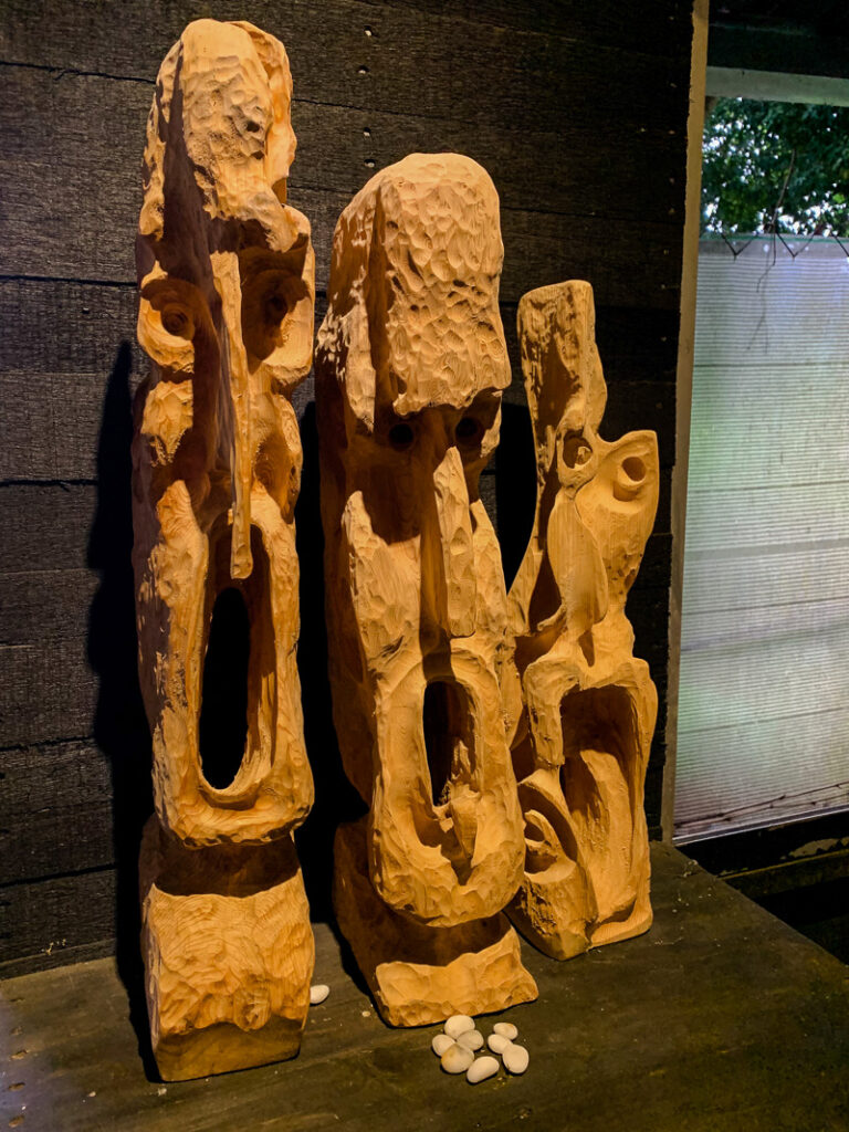 Carved figures on display at 4.5 KM Coffee.