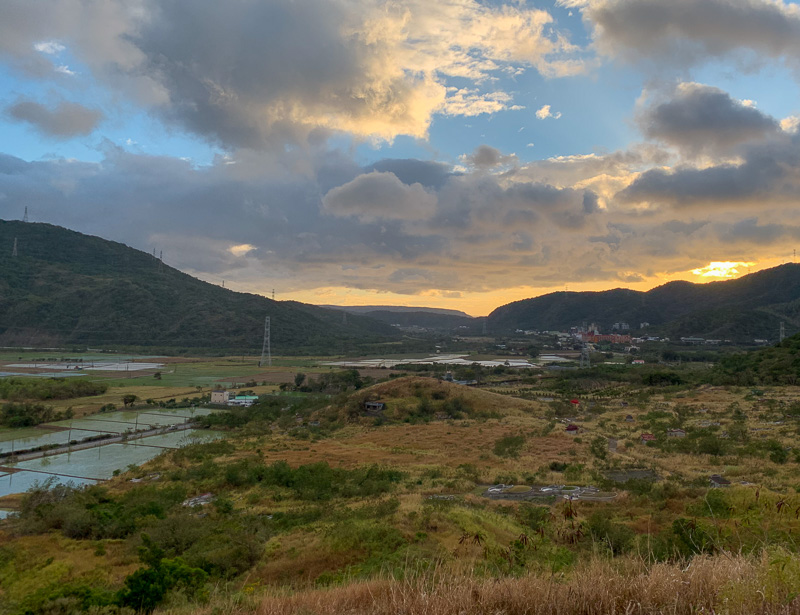 The sun sets over the historic battlefield of Macacukes Gorge in Mudan Township.