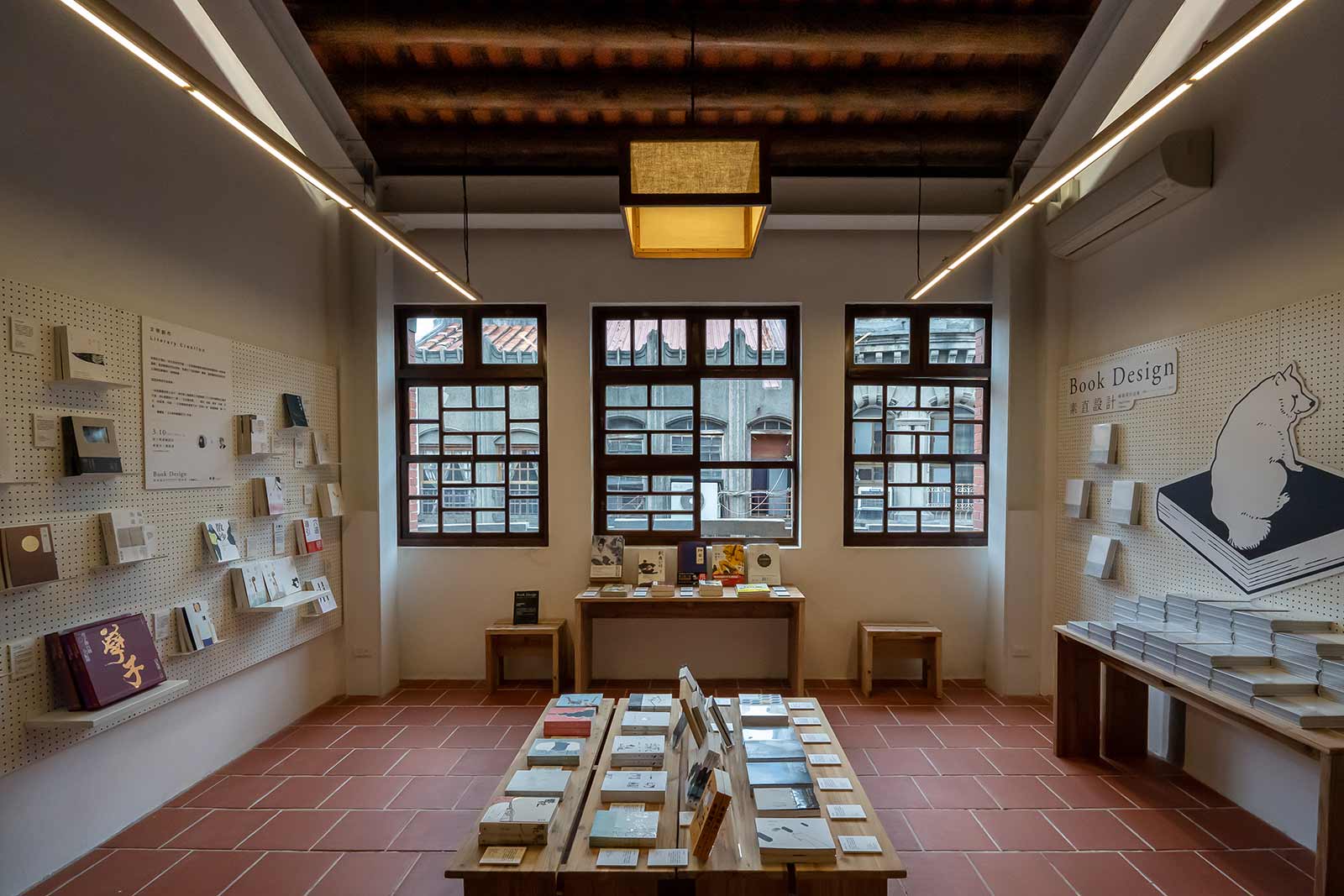 Books on display in an open space on the second floor of a renovated old home.