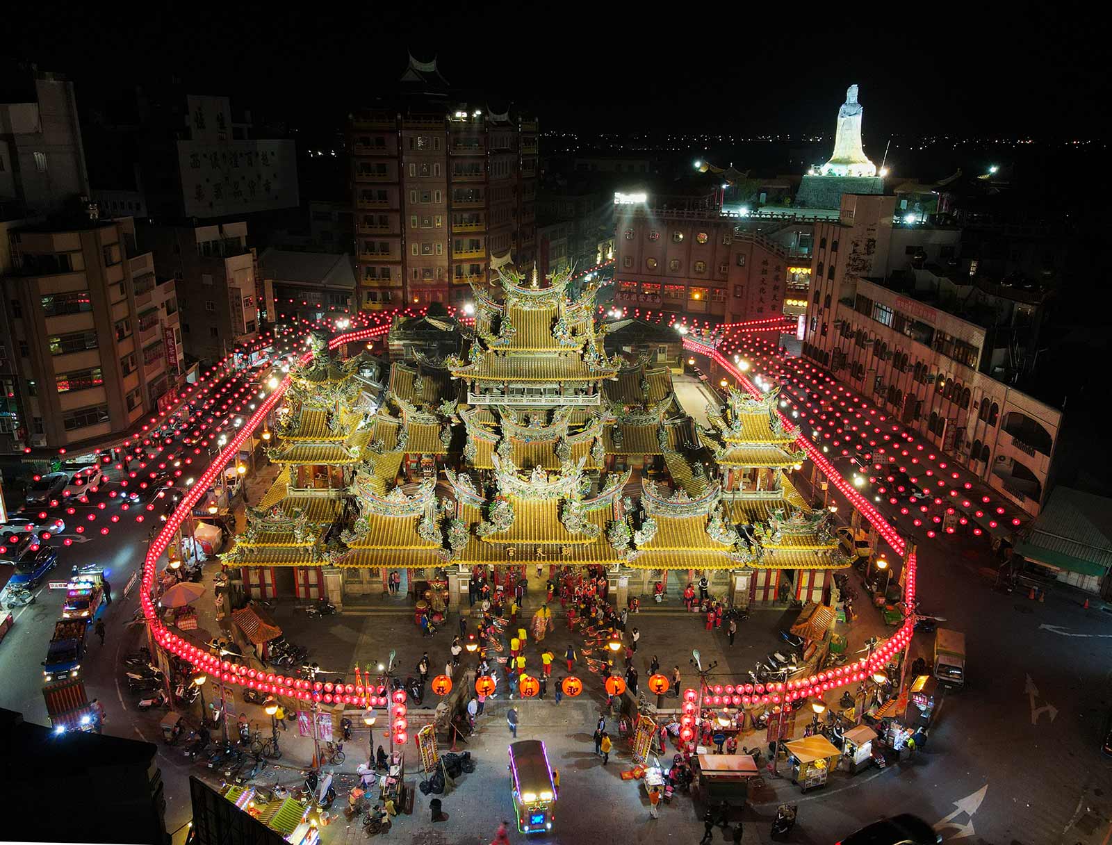Chaotian Temple, seen from above, stands surrounded by rows of red lanterns suspended above the street.