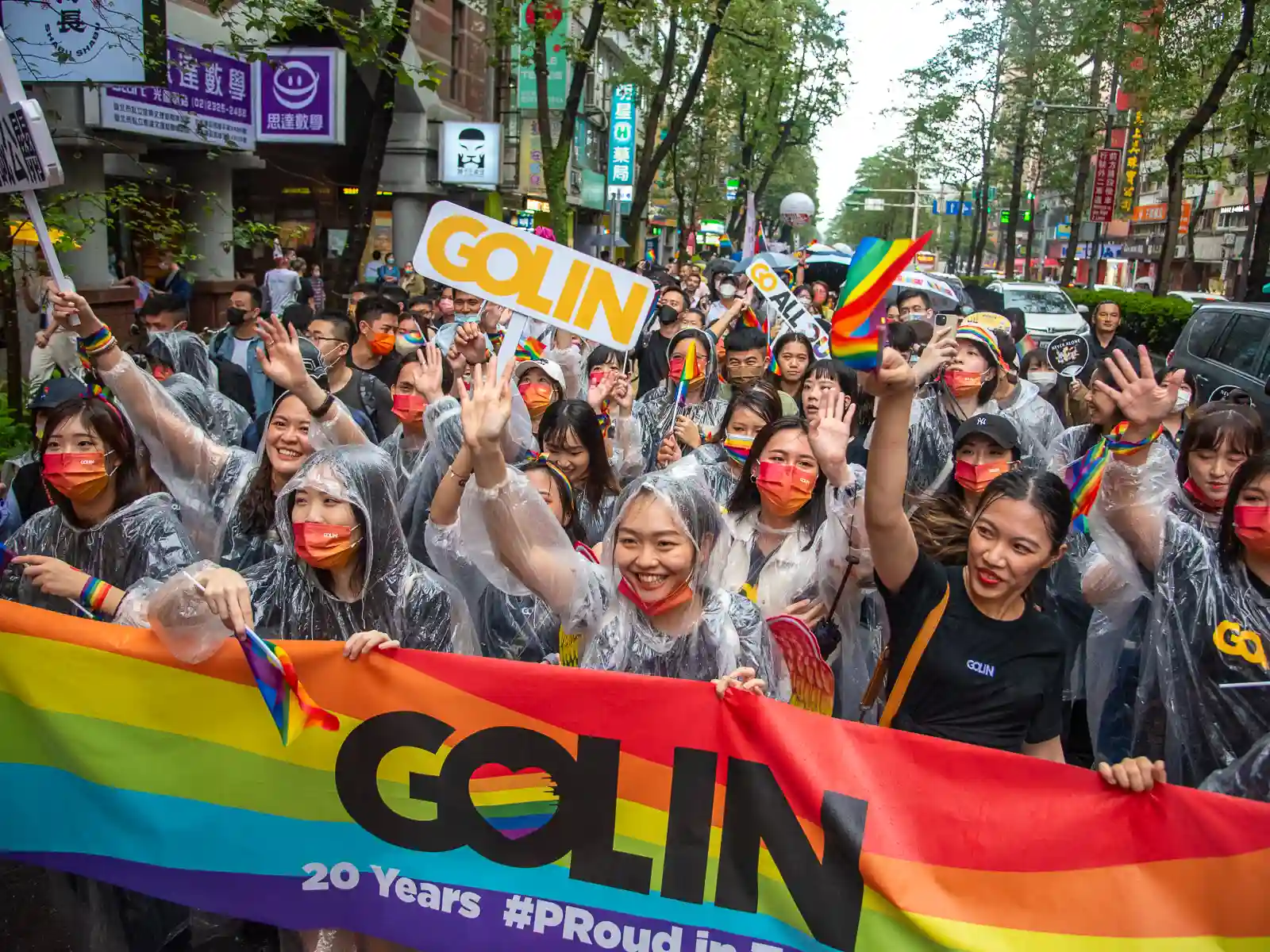 Employees from the PR Agency, Golin, march in the Pride parade.