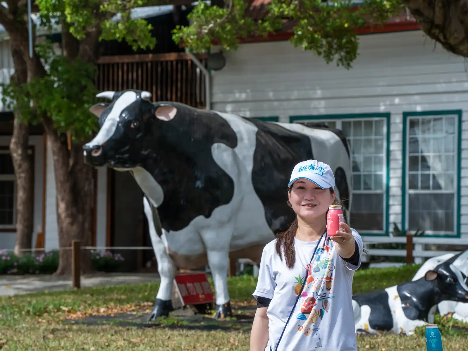 A tourist smiling as she enjoys a farm-made yogurt.