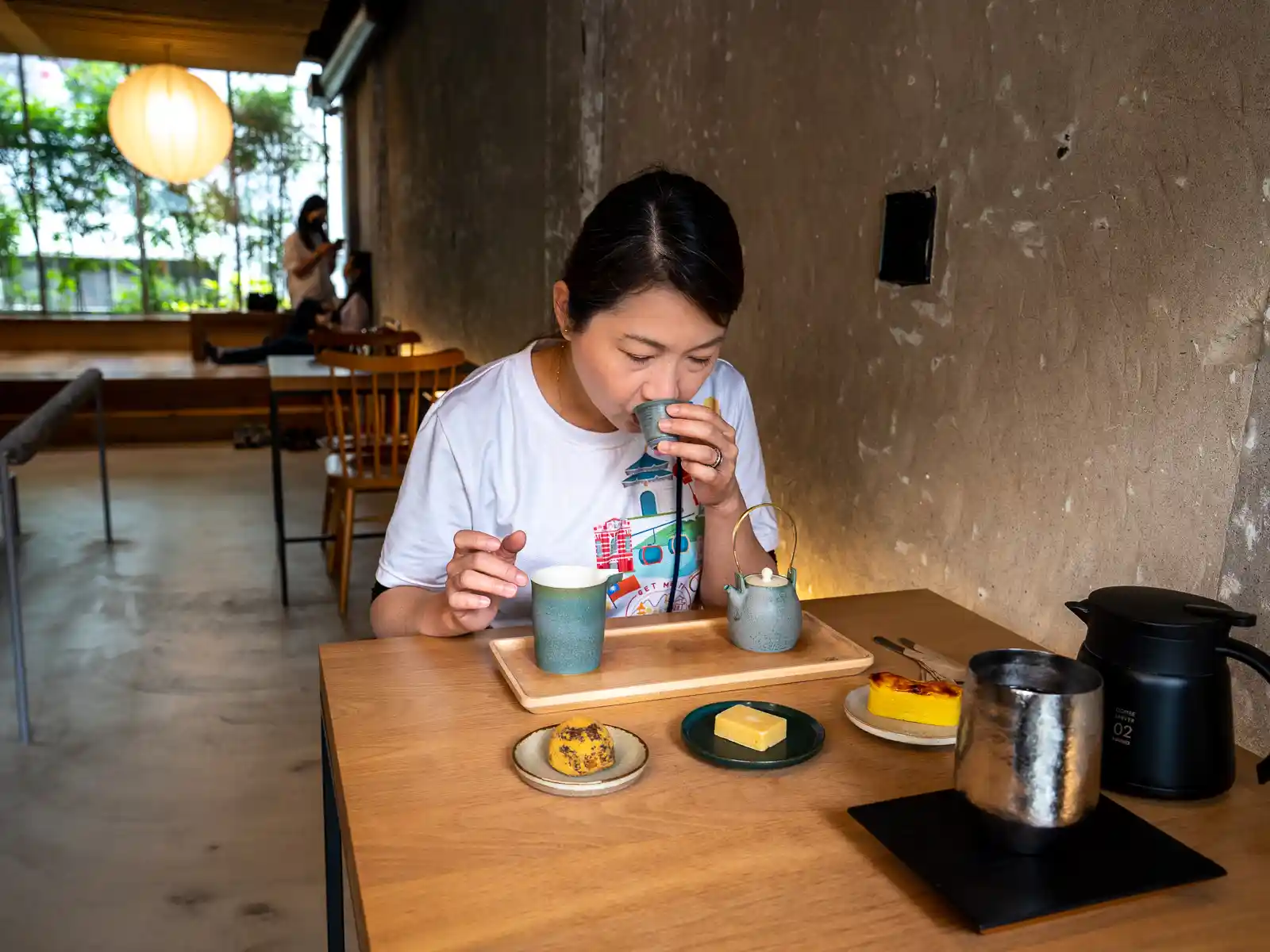 A customer sampling tea at Zhao Zhao Tea Lounge.