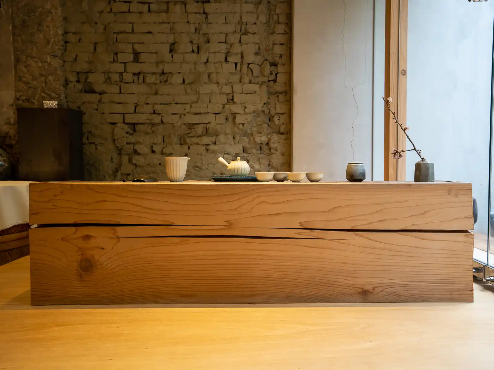 A minimalist rectangular table with a tea set in Zhao Zhao Tea Lounge.
