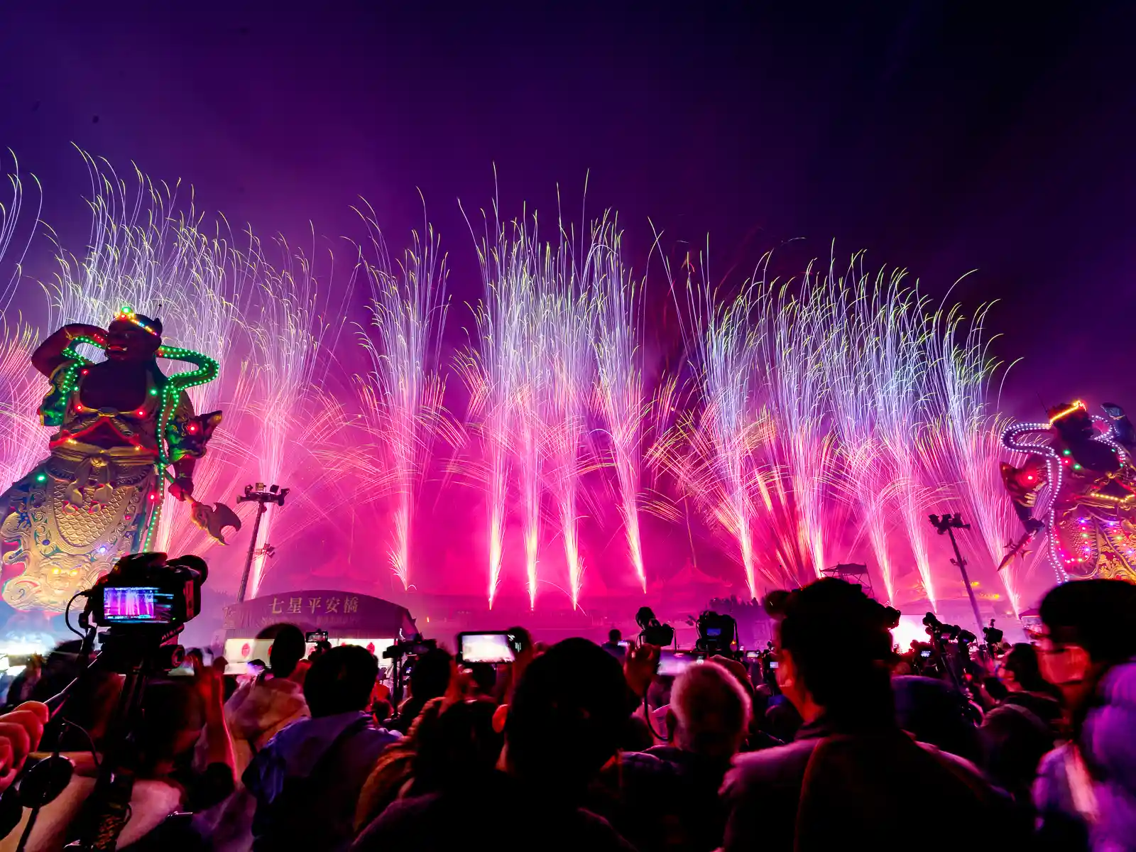 Fountain-shaped fireworks erupt from within Luerman Mazu Temple.