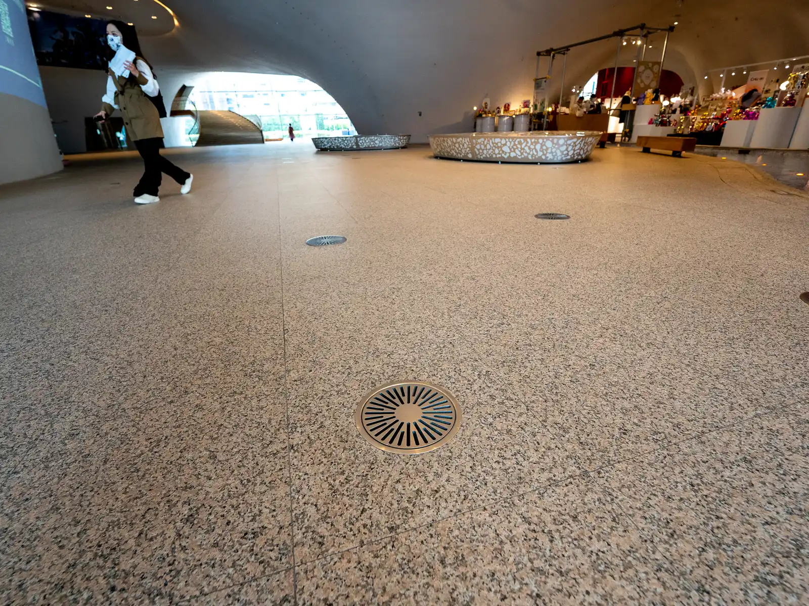 Small circular floor vents can be seen on the first floor of the National Taichung Theater.
