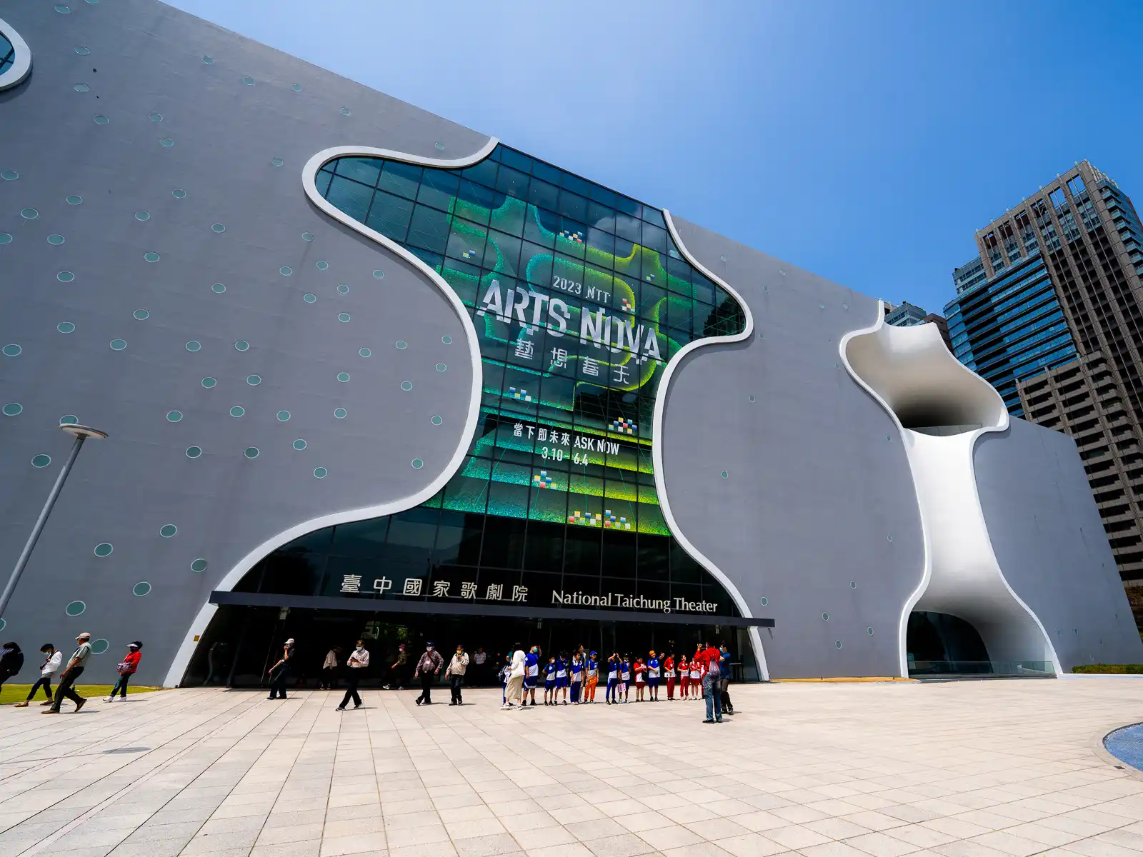 The front facade of National Taichung Theater is simple with flowing edges.